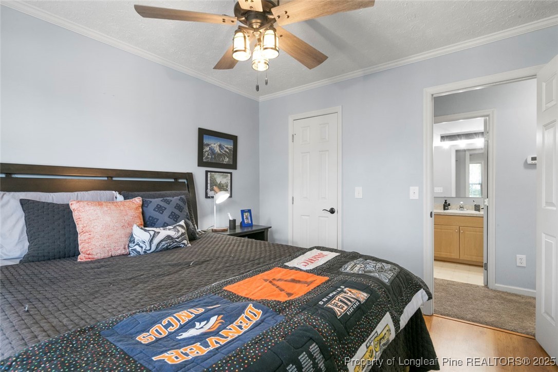 59 Prestige Drive Cameron, NC 28326 - Photo 26 of 36 a bedroom with a bed and a lamp