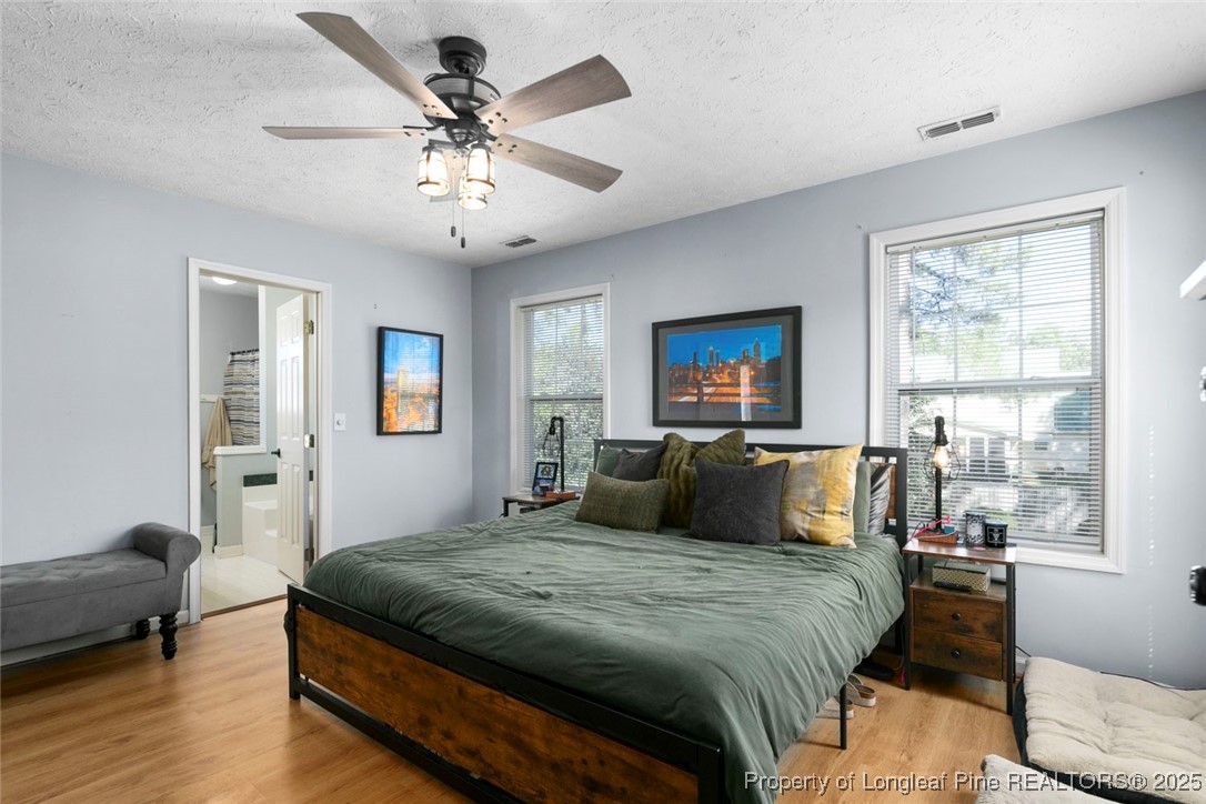 59 Prestige Drive Cameron, NC 28326 - Photo 30 of 36 a bedroom with a large bed and a window