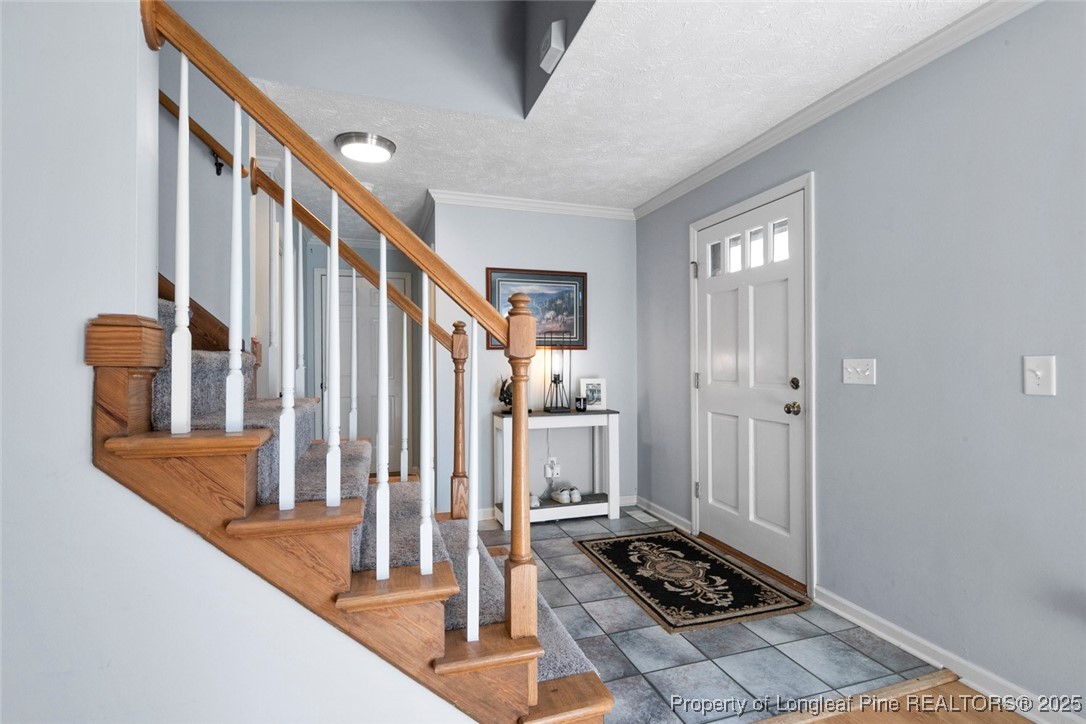 59 Prestige Drive Cameron, NC 28326 - Photo 3 of 36 a view of a hallway with wooden floor and staircase