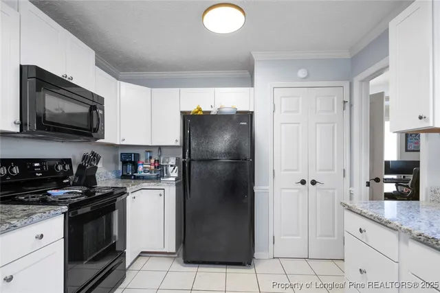 a kitchen with a refrigerator sink and microwave