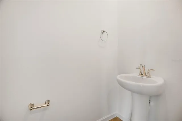 a bathroom with a sink and mirror
