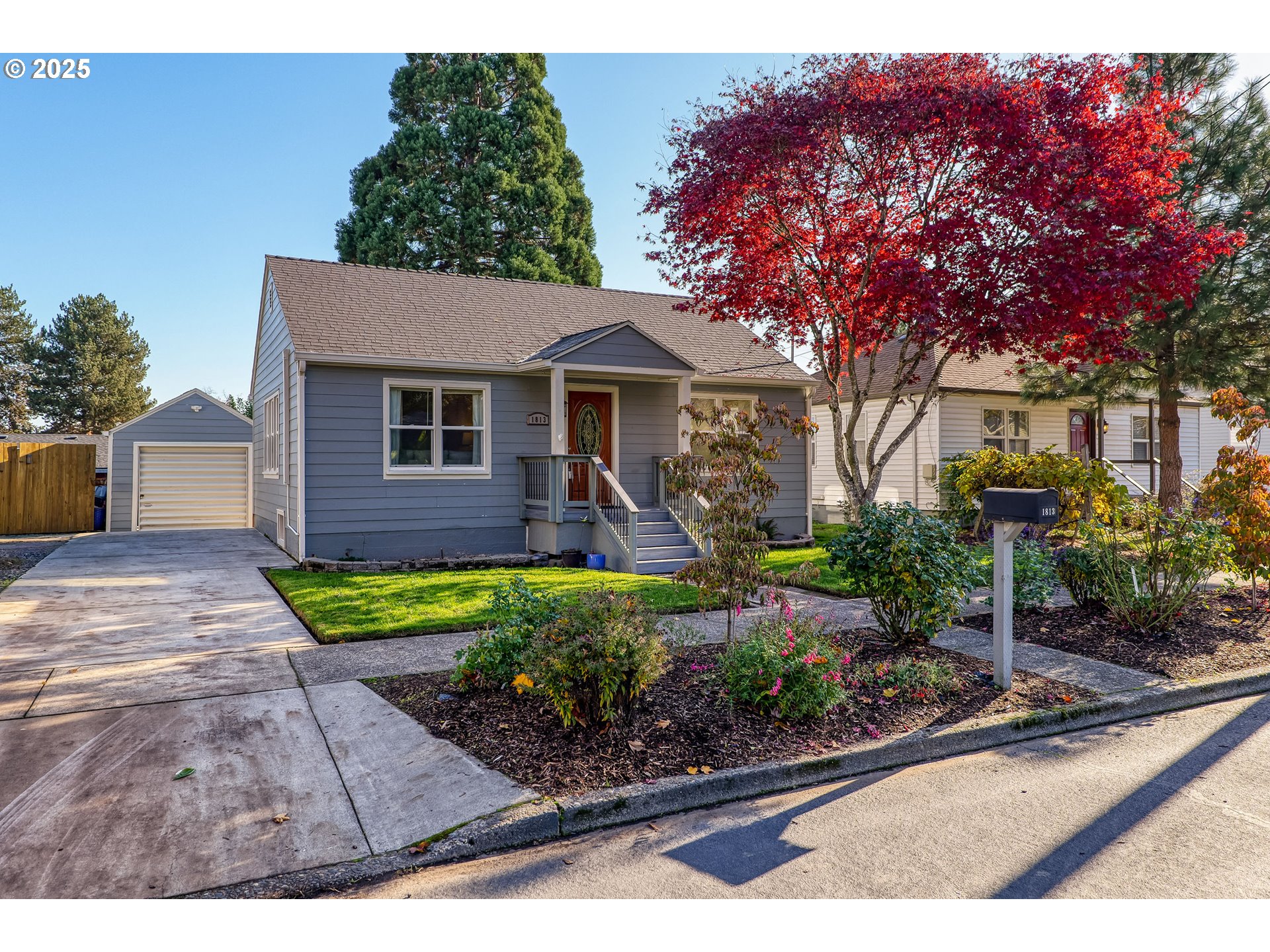 1813 Filbert Street Forest Grove, OR 97116 - Photo 1 of 23 a front view of a house with garden