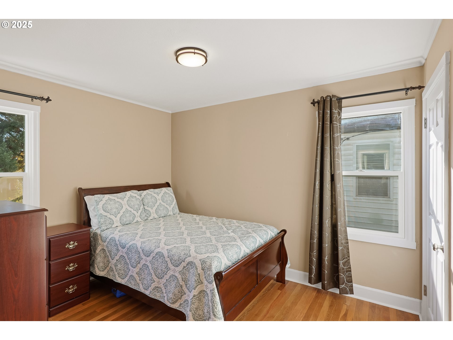 1813 Filbert Street Forest Grove, OR 97116 - Photo 13 of 23 a bedroom with a bed and a mirror