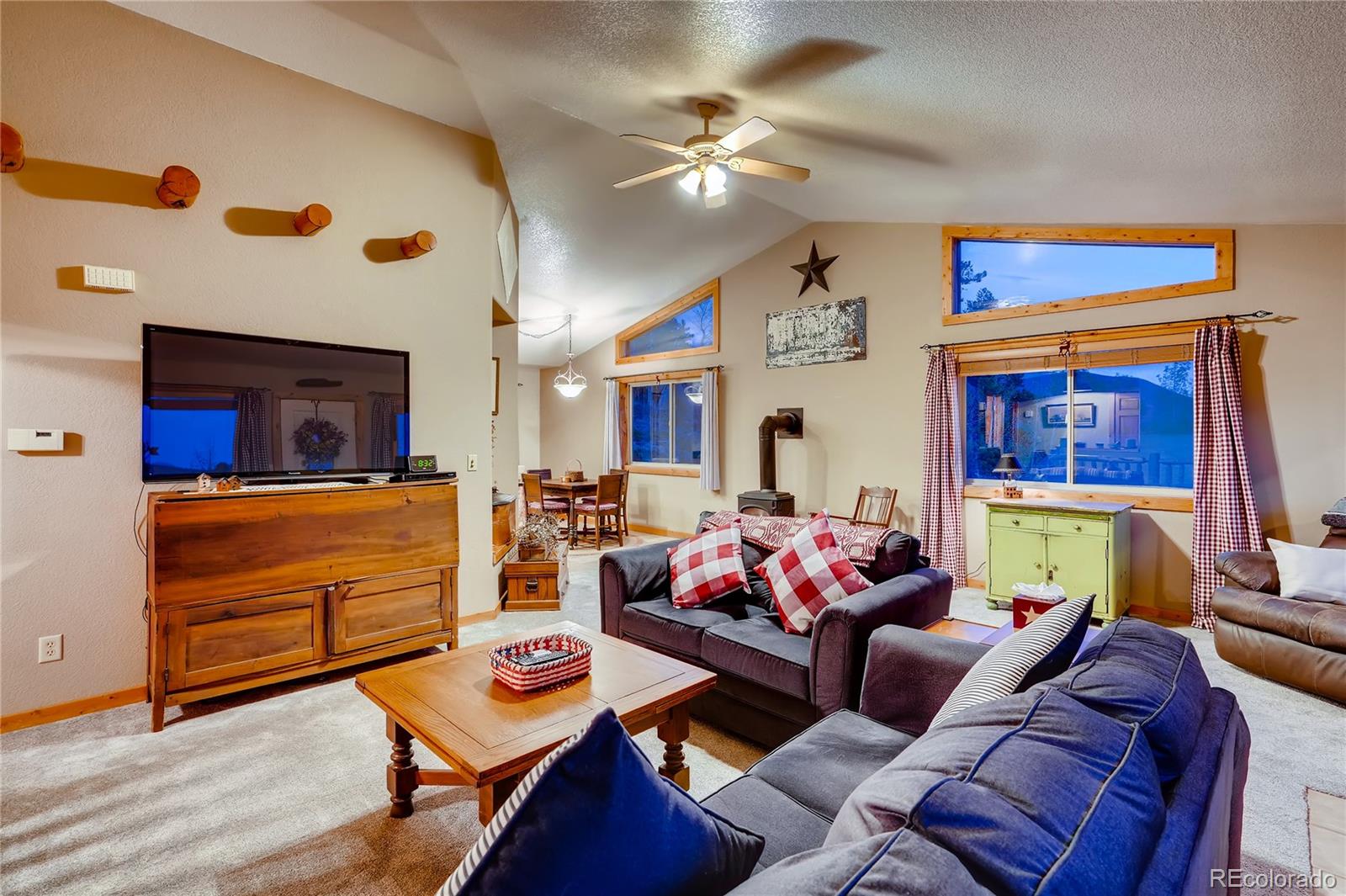 7120 County Road 43 Bailey, CO 80421 - Photo 15 of 37 a living room with furniture and a flat screen tv
