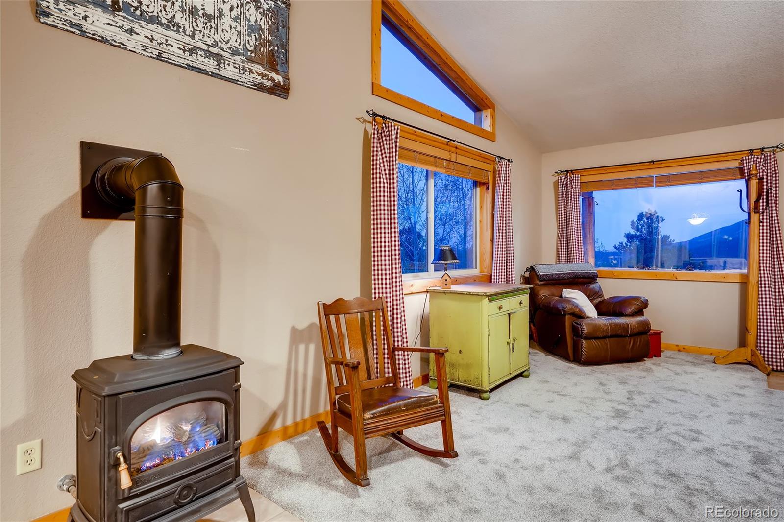 7120 County Road 43 Bailey, CO 80421 - Photo 16 of 37 a living room with furniture and a fireplace