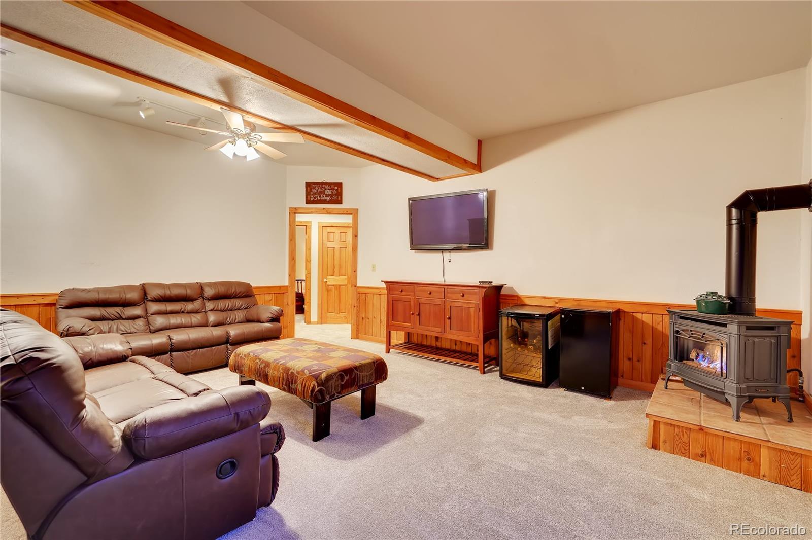 7120 County Road 43 Bailey, CO 80421 - Photo 29 of 37 a living room with furniture and a flat screen tv