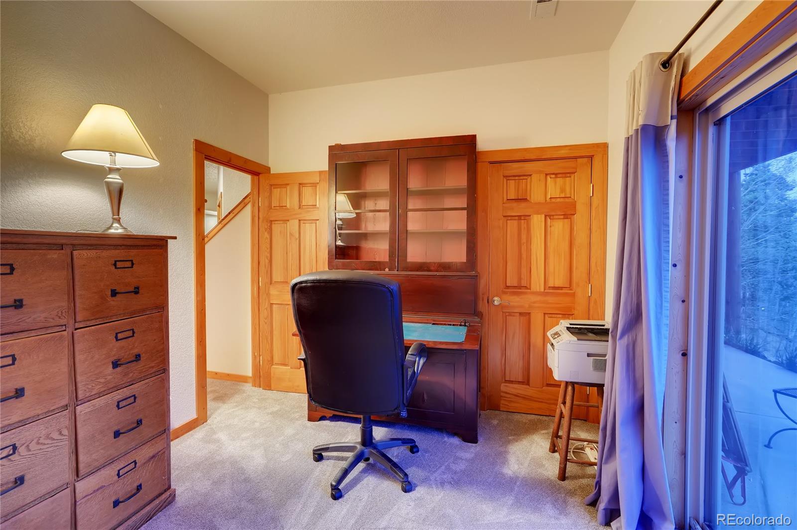 7120 County Road 43 Bailey, CO 80421 - Photo 31 of 37 a view of a workspace with furniture and a window