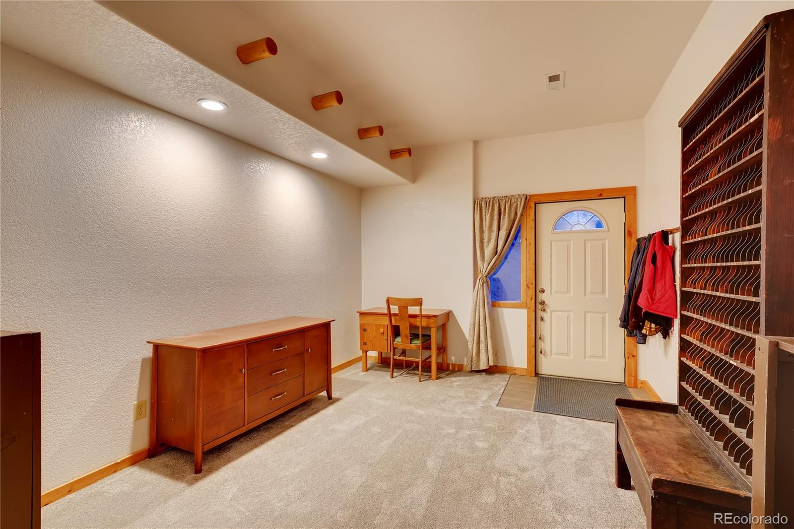 7120 County Road 43 Bailey, CO 80421 - Photo 32 of 37 a view of an empty room with furniture and storage