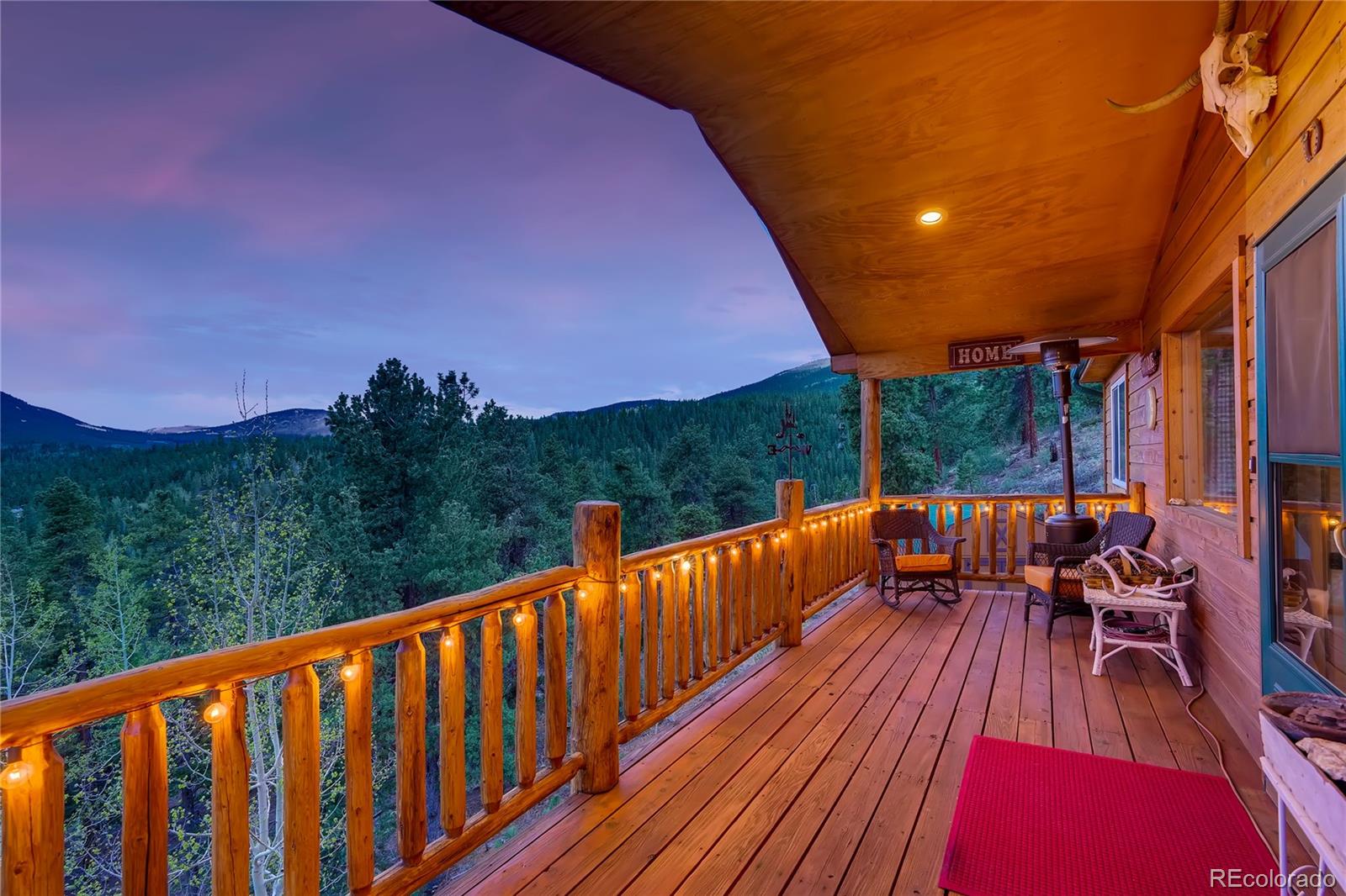 7120 County Road 43 Bailey, CO 80421 - Photo 37 of 37 a balcony with wooden floor and outdoor seating