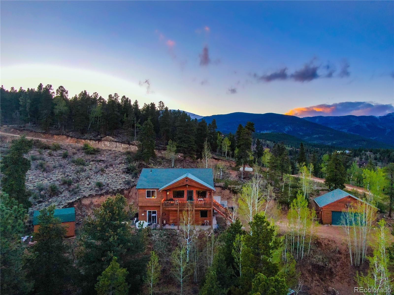7120 County Road 43 Bailey, CO 80421 - Photo 4 of 37 a view of a house with a yard and balcony