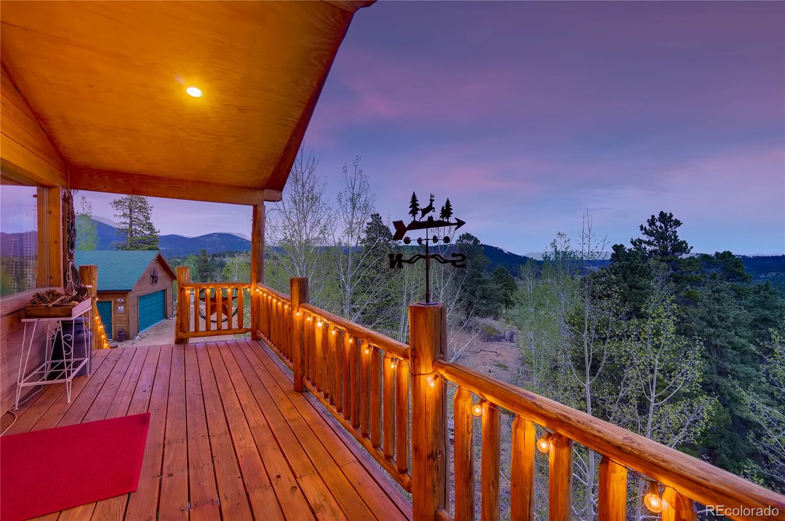 7120 County Road 43 Bailey, CO 80421 - Photo 5 of 37 a balcony with wooden floor and city view