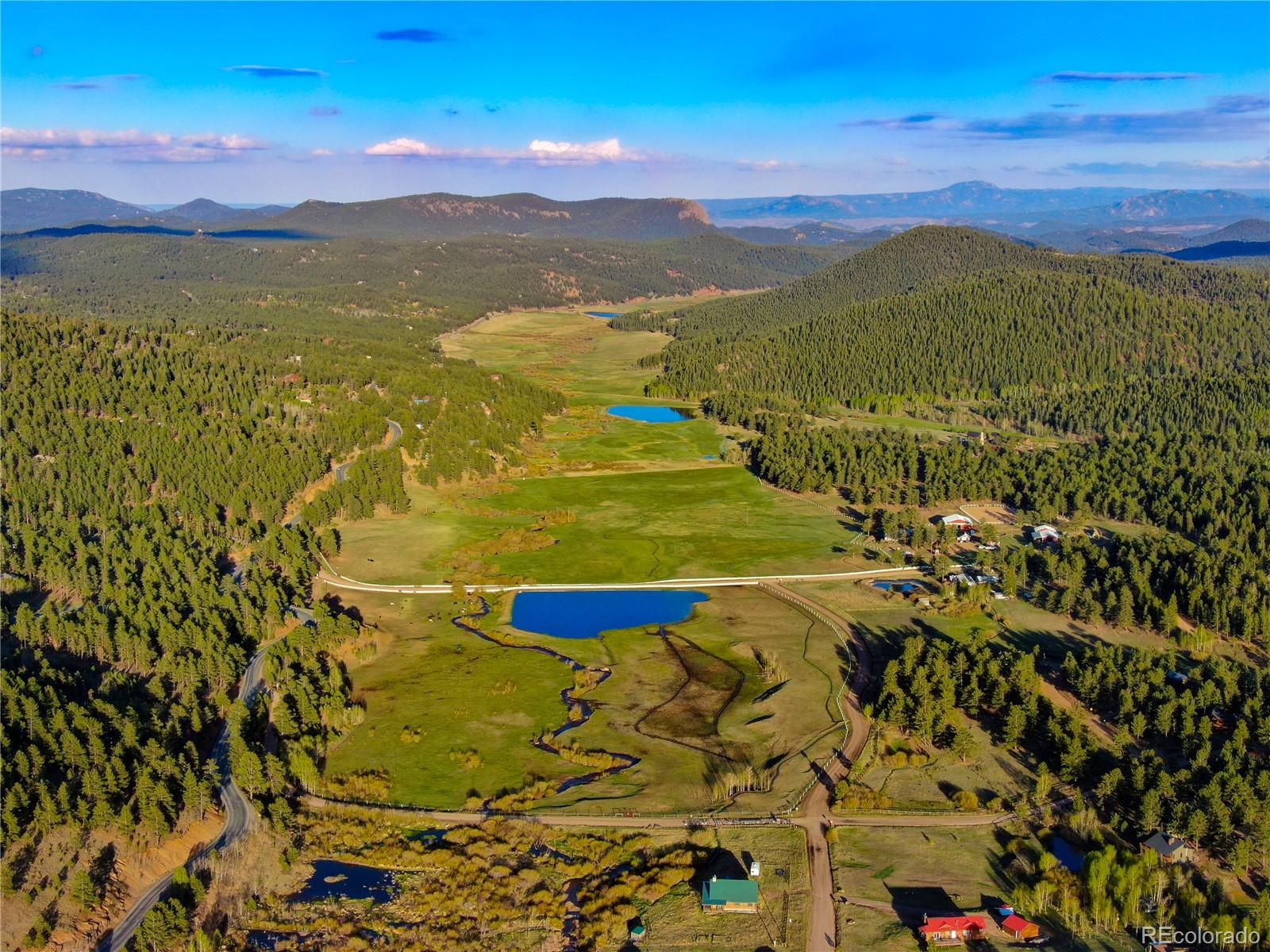 7120 County Road 43 Bailey, CO 80421 - Photo 8 of 37 a view of an aerial view of residential houses with outdoor space