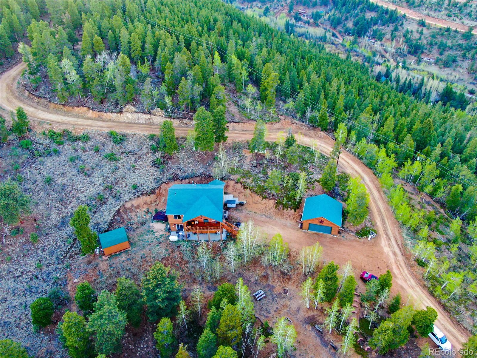 7120 County Road 43 Bailey, CO 80421 - Photo 10 of 37 an aerial view of a house with a yard