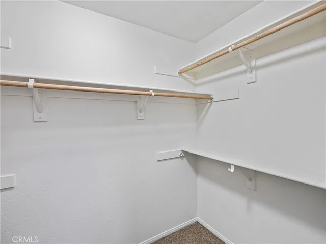 a bathroom with a double vanity sink mirror and toilet