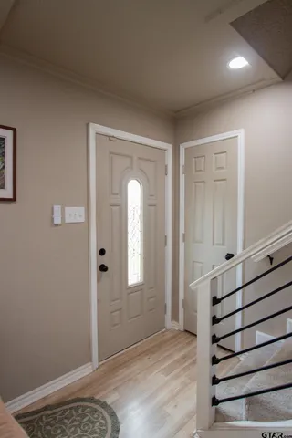 a view of a livingroom with wooden floor and cabinet
