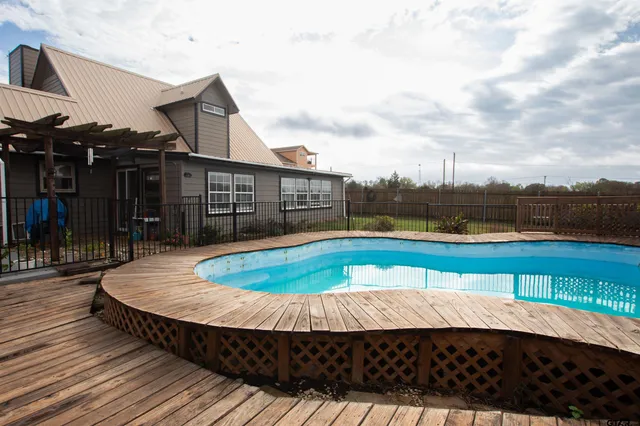 a view of a swimming pool with a lounge chairs