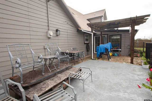 a view of outdoor sitting area with furniture