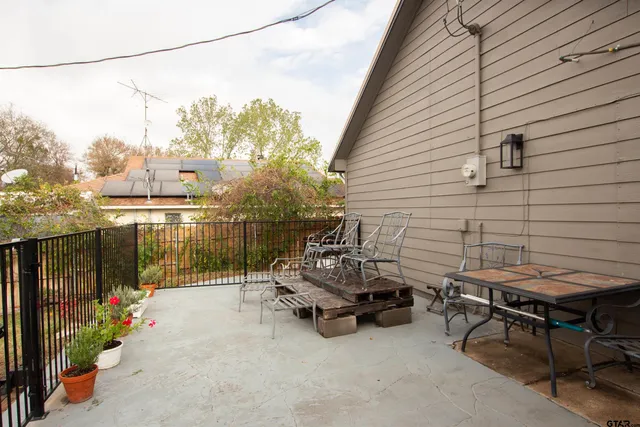 a view of a terrace with sitting area