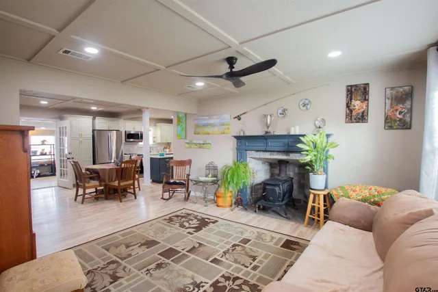 a living room with furniture a fireplace and a table