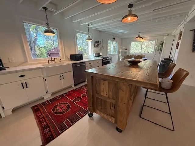 a room with furniture a window and gym equipment