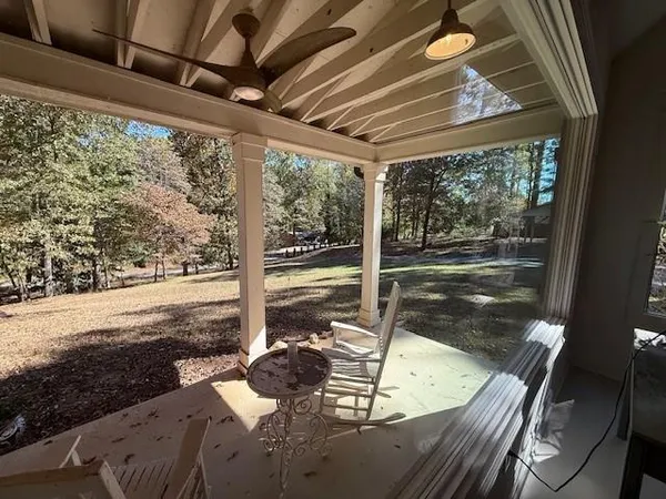a view of a living room and a floor to ceiling window