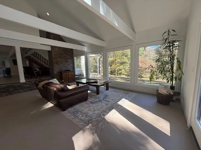 a living room with furniture and a large window