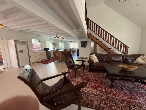 a living room with furniture and a table