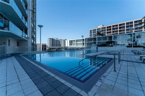 a swimming pool with outdoor seating and yard