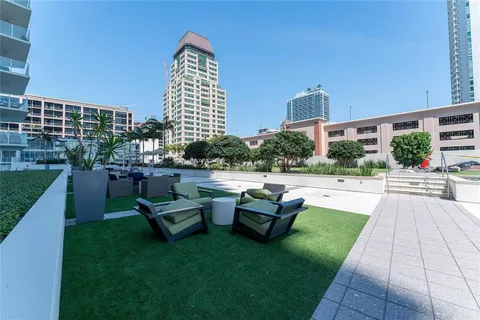a view of an house with backyard and patio