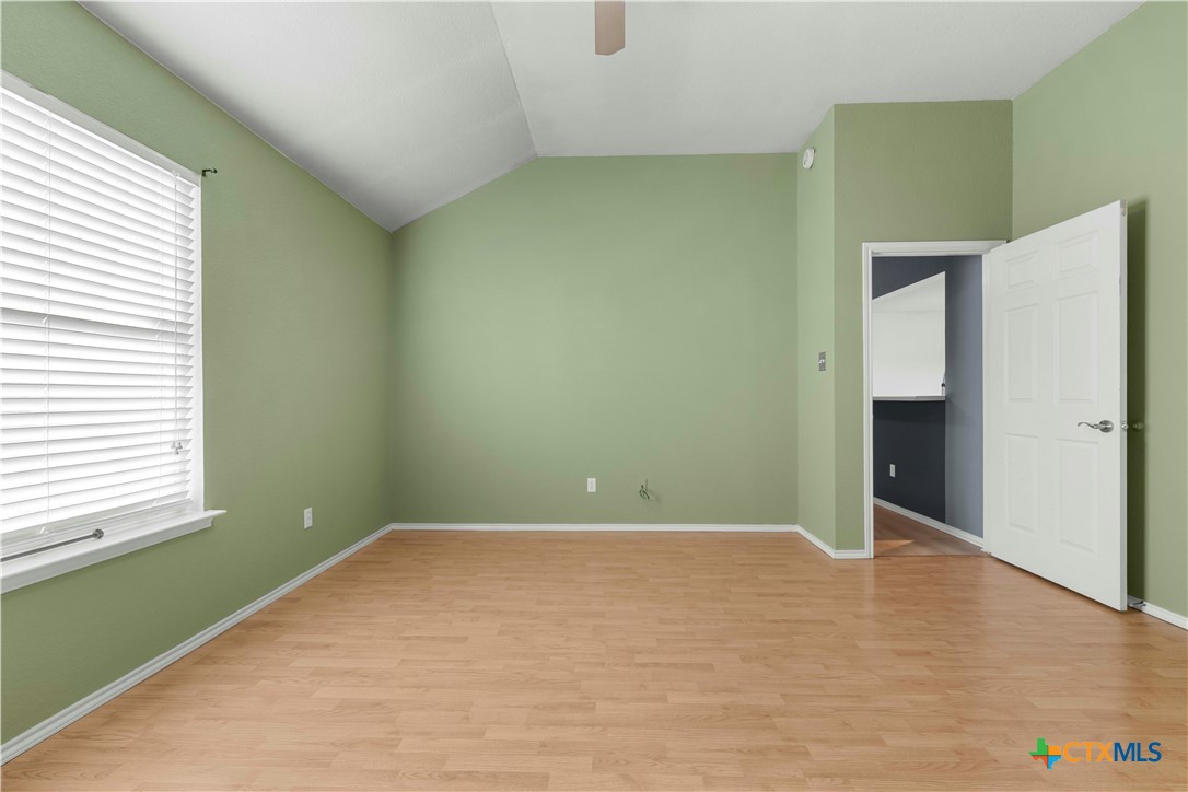 3624 Rainforest Lane Killeen, TX 76549 - Photo 16 of 27 a view of an empty room with wooden floor and a window