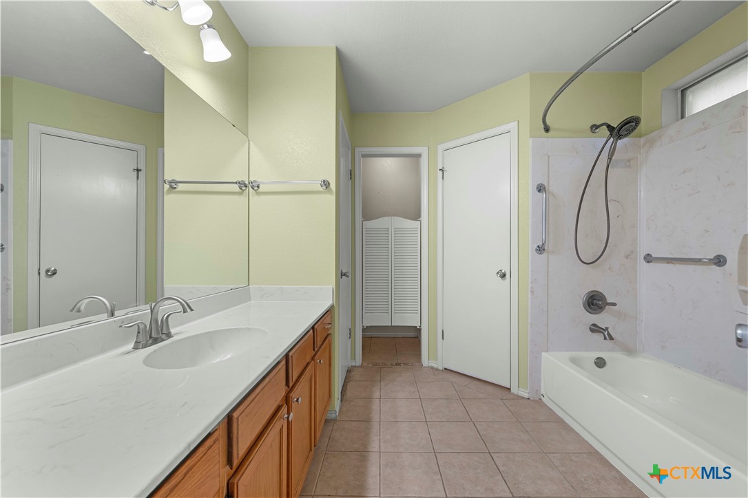 3624 Rainforest Lane Killeen, TX 76549 - Photo 17 of 27 a bathroom with a tub sink shower and mirror