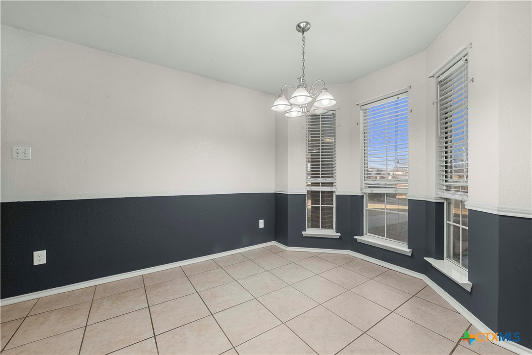 3624 Rainforest Lane Killeen, TX 76549 - Photo 23 of 27 a view of a livingroom with furniture wooden floor and chandelier