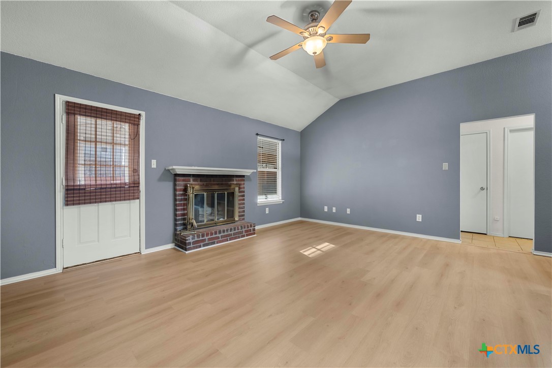 3624 Rainforest Lane Killeen, TX 76549 - Photo 4 of 27 a view of an empty room with a fireplace and a window