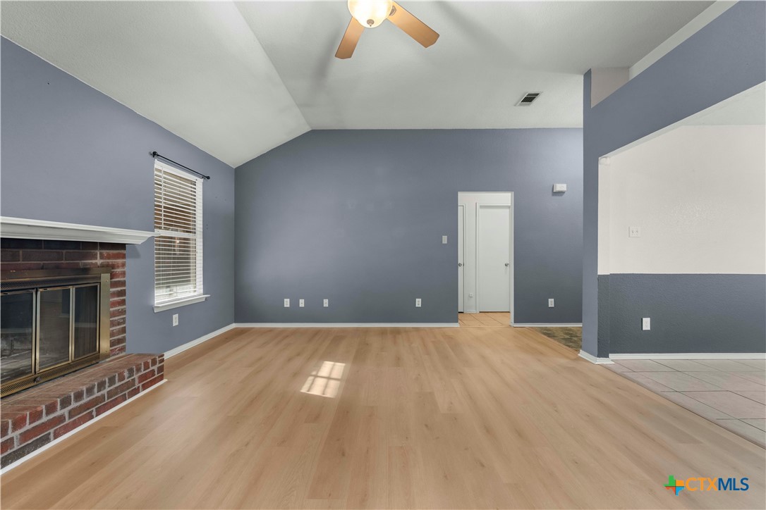 3624 Rainforest Lane Killeen, TX 76549 - Photo 5 of 27 a view of an empty room with window and fire place
