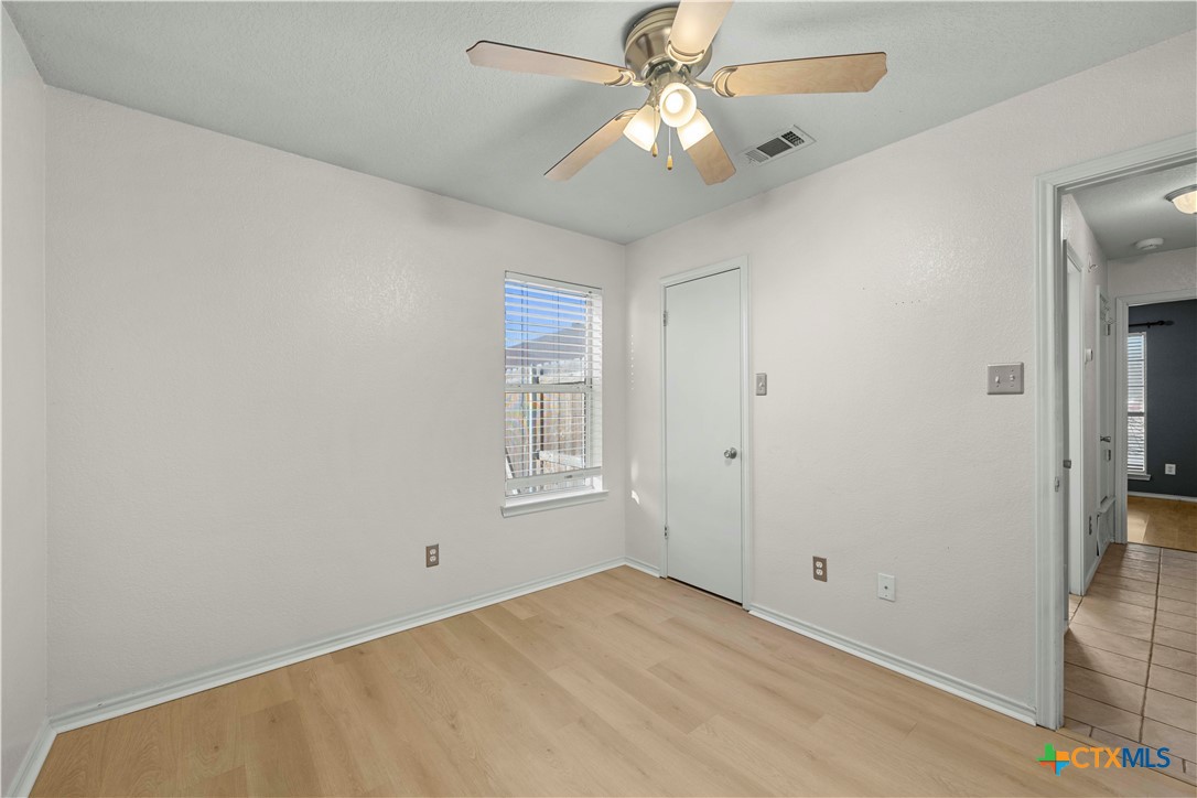 3624 Rainforest Lane Killeen, TX 76549 - Photo 8 of 27 an empty room with windows and fan