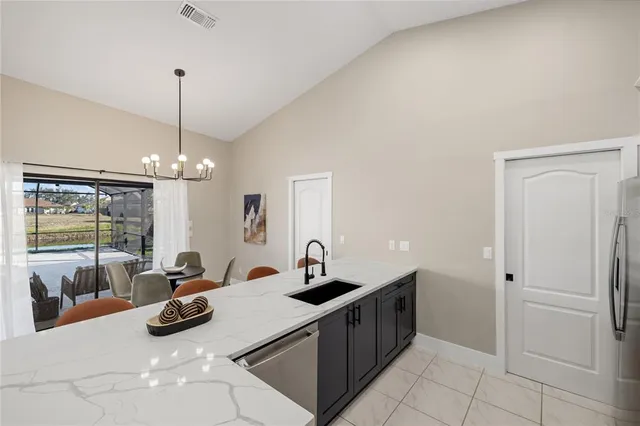 a kitchen with a sink and a large window