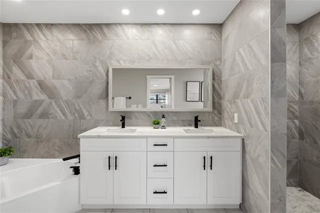 a bathroom with a sink vanity and a mirror