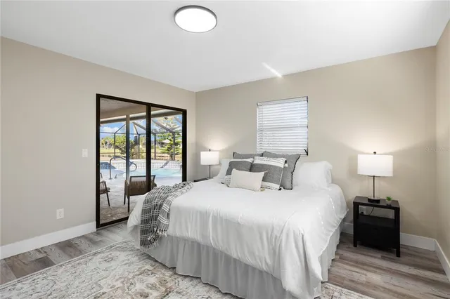 a bedroom with furniture and a window