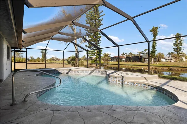 a view of a swimming pool with a patio