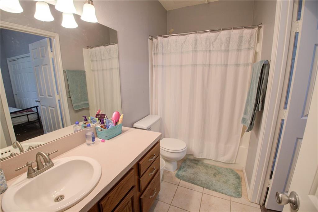 2606 Rio Grande Street, Unit 101 Austin, TX 78705 - Photo 11 of 24 a bathroom with a sink and a mirror