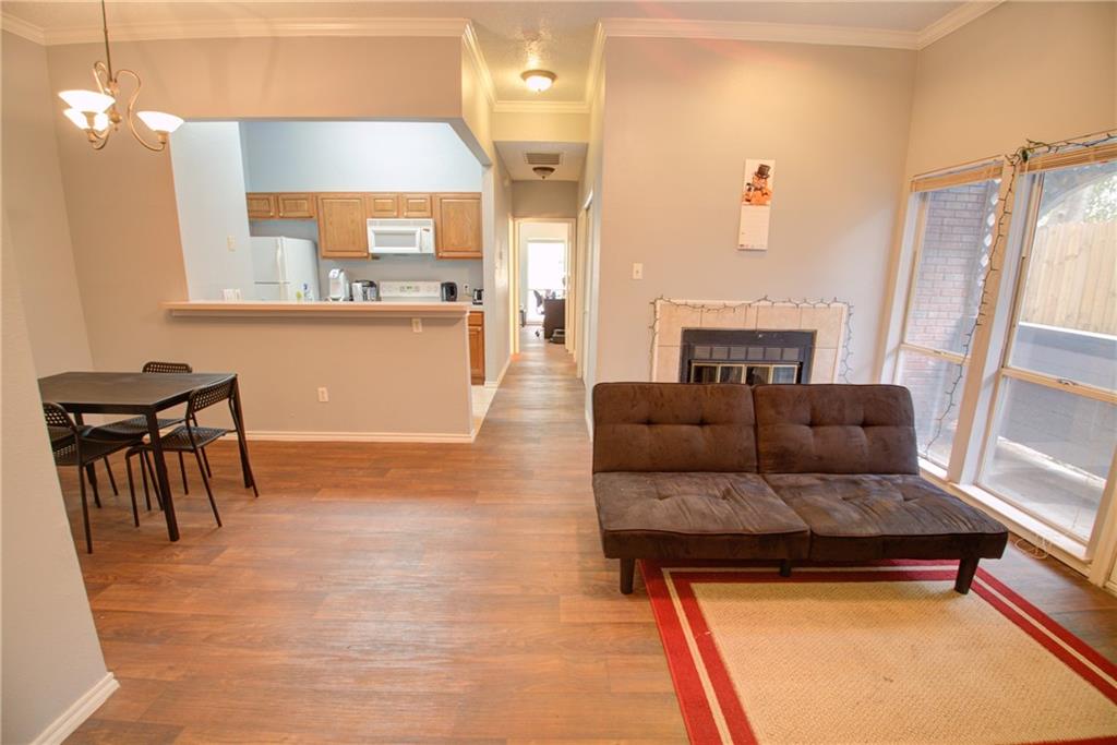 2606 Rio Grande Street, Unit 101 Austin, TX 78705 - Photo 15 of 24 a living room with furniture and a fireplace