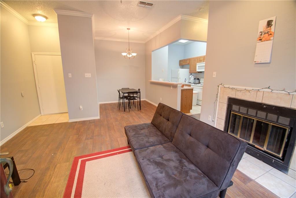 2606 Rio Grande Street, Unit 101 Austin, TX 78705 - Photo 20 of 24 a living room with furniture and a table