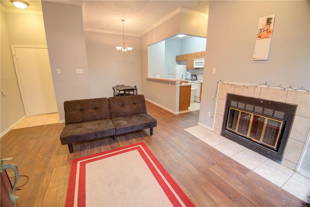 2606 Rio Grande Street, Unit 101 Austin, TX 78705 - Photo 21 of 24 a living room with furniture and a fireplace