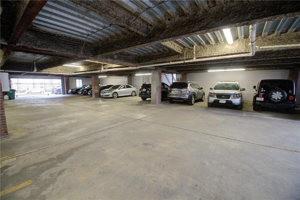 2606 Rio Grande Street, Unit 101 Austin, TX 78705 - Photo 22 of 24 a view of parking garage with cars