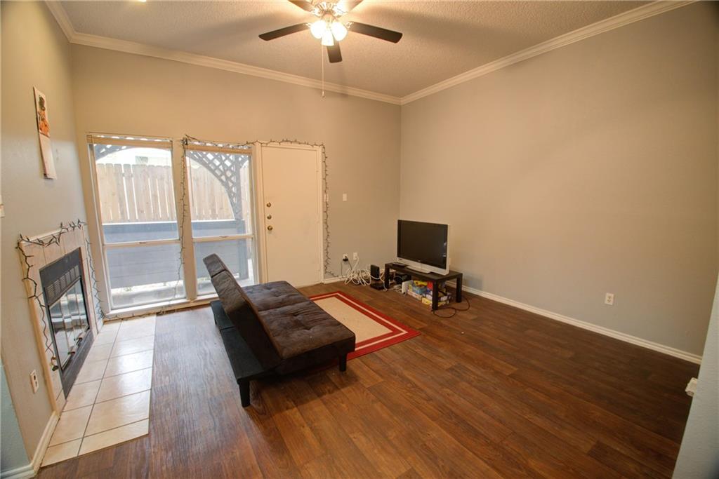 2606 Rio Grande Street, Unit 101 Austin, TX 78705 - Photo 3 of 24 a living room with furniture and a flat screen tv