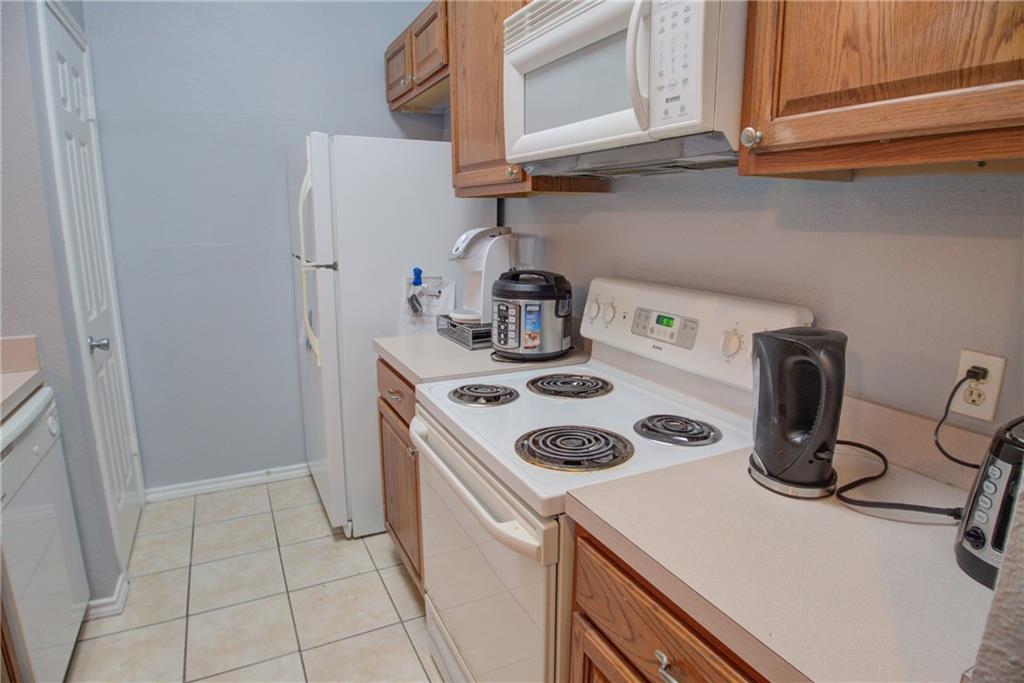 2606 Rio Grande Street, Unit 101 Austin, TX 78705 - Photo 6 of 24 a kitchen with a stove and a refrigerator
