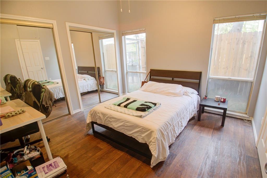 2606 Rio Grande Street, Unit 101 Austin, TX 78705 - Photo 7 of 24 a bedroom with a bed and a large window