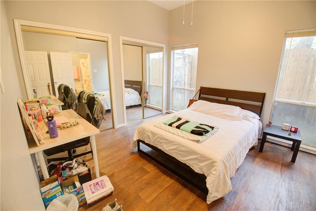 2606 Rio Grande Street, Unit 101 Austin, TX 78705 - Photo 9 of 24 a bedroom with bed and a window