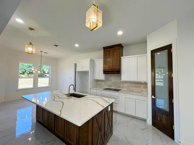 a kitchen with a sink counter top space and appliances
