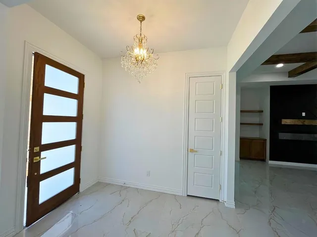 a view of a hallway with a bathroom